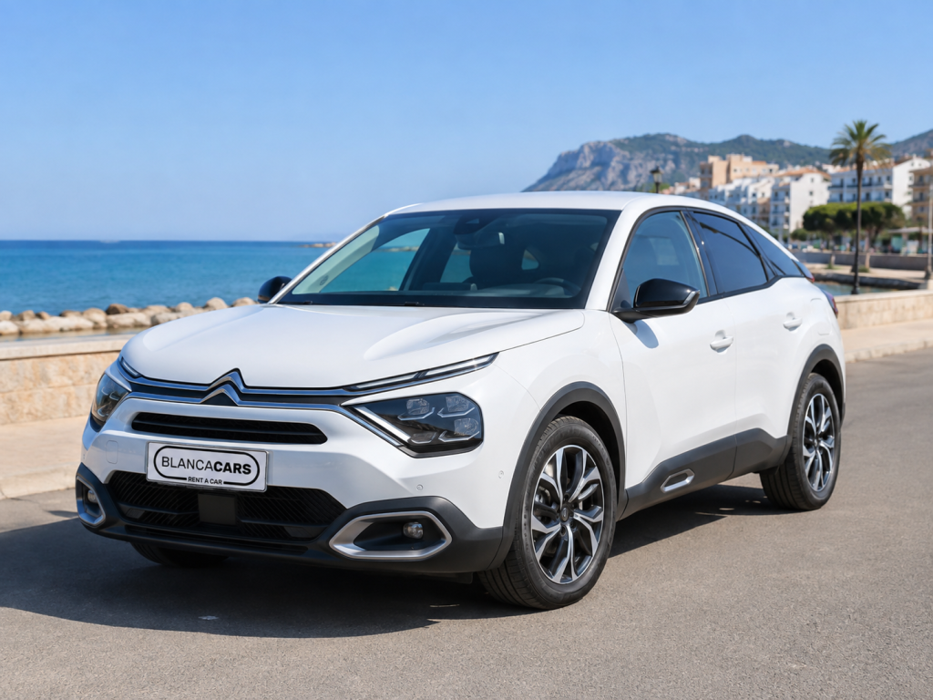 White Citroen C4 automatic rental car in Cumbre del Sol.